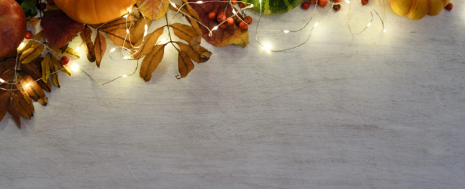 Festive autumn decor with pumpkins and lights, representing energy-efficient holiday solutions with Sea Bright Solar.